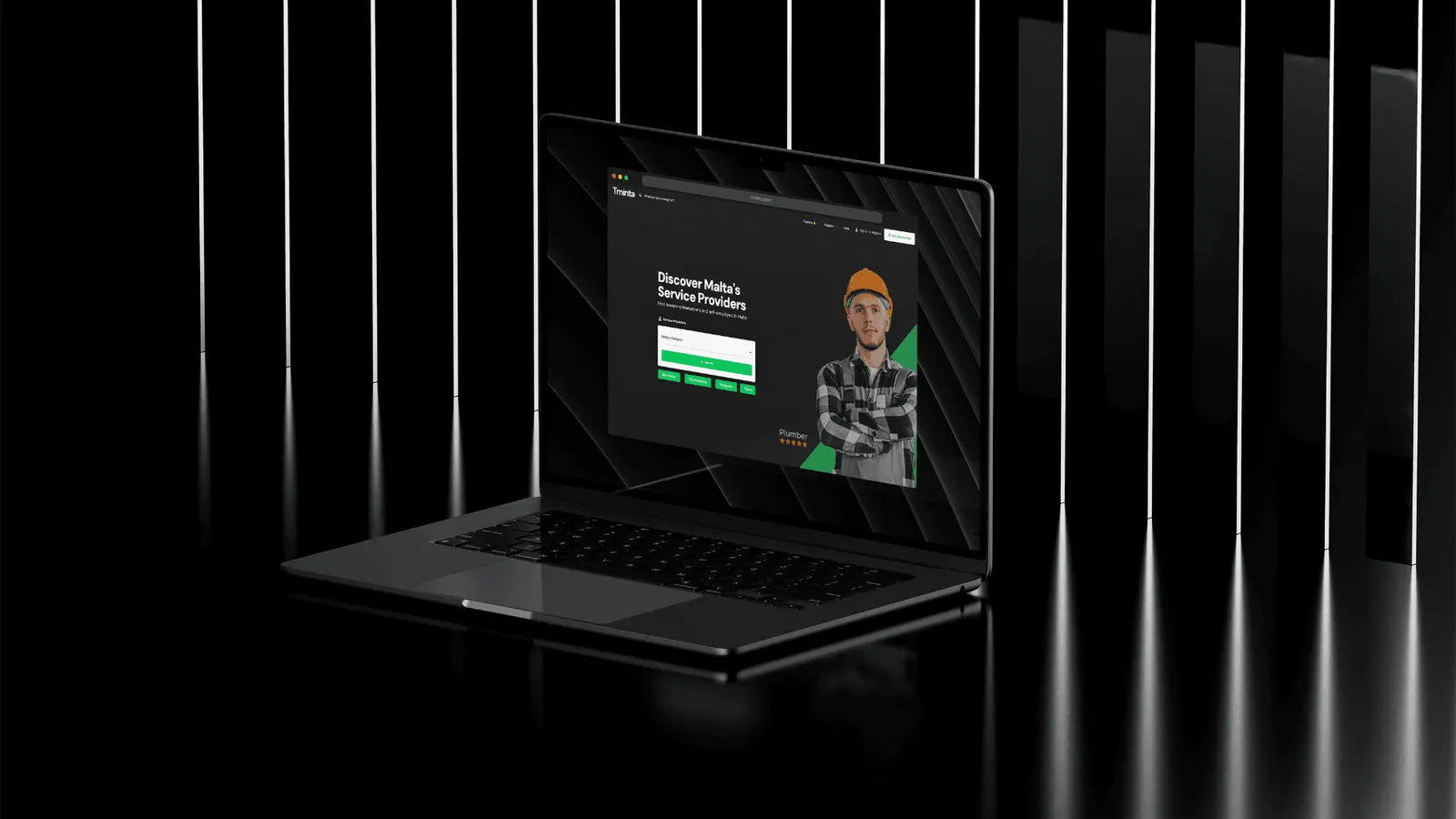 Tminta website on a laptop in a dark room